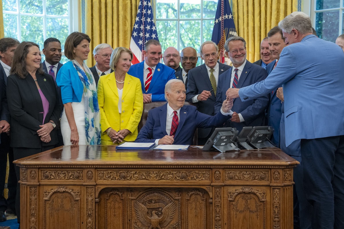 President Joe Biden signs the Fire Act.
