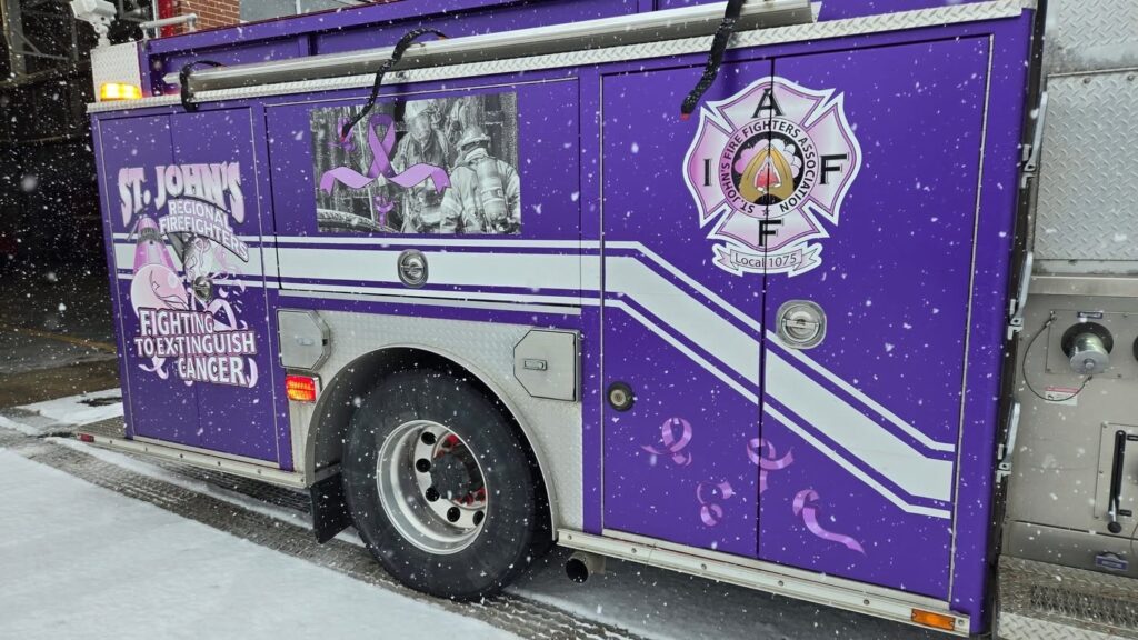St. John's cancer awareness-themed engine with Local 1075 and SJRFES logos